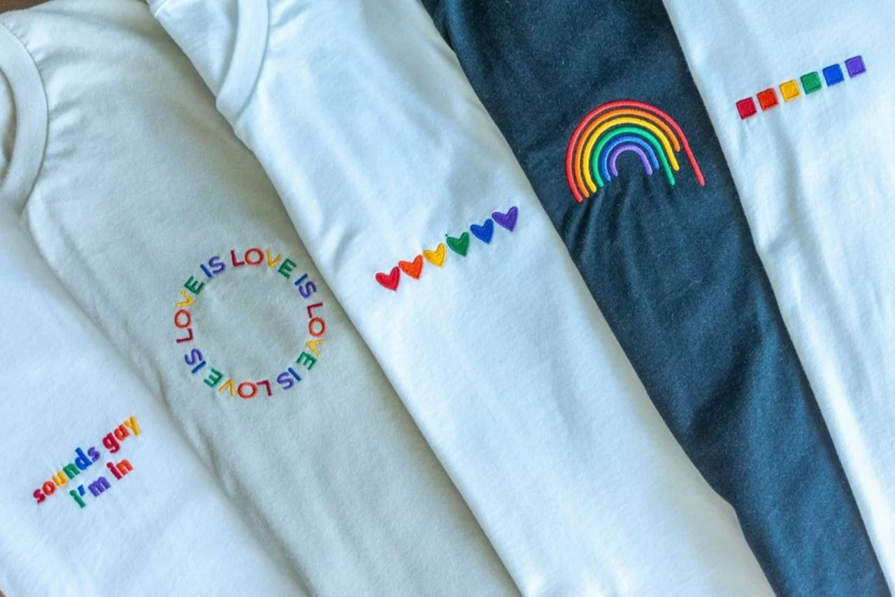 a group of t-shirts with embroidered designs